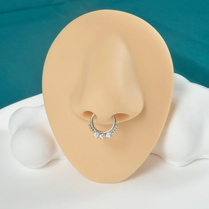 Professional silver nose ring with clear gemstones displayed on a silicone model