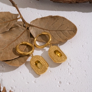 Elegant gold-tone stainless steel hammered rectangle drop earrings on natural background