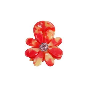 Pince à cheveux marguerite en acétate marbré rouge et jaune avec centre en cristal