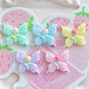 Pastel resin butterfly accessories with rose flower centers for DIY crafts and jewelry