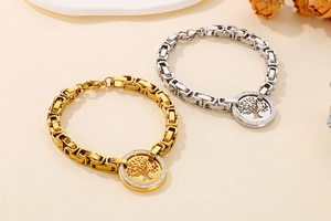 Detailed close-up of gold and silver Tree of Life bracelets with sparkling crystal accents