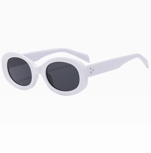 Detail of white oval sunglasses showing silver triple-dot rivets on the hinge