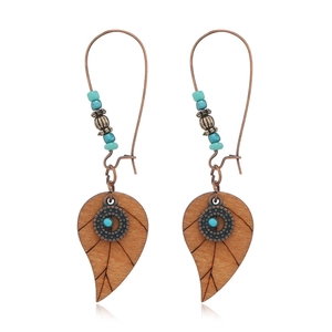 Bohemian hollow brown wooden leaf earrings with antique bronze metal and blue beads