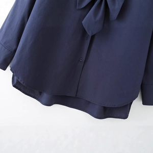 Navy blue cotton poplin long sleeve shirt with tie neck and curved hem detail