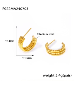 Detail view of 1.8cm gold titanium steel hoop earrings with textured C-shape pattern