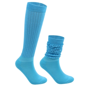 Detailed knit texture of light blue slouch socks with elastic ribbed design on white backdrop