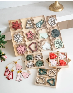 Close-up of Nordic wooden Christmas ornaments in a grid box for holiday tree decoration