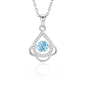 Macro view of S925 silver necklace featuring a blue dancing stone in teardrop pendant