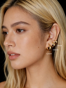 Three sizes of 925 sterling silver gold hoop earrings shown on model ear for size comparison