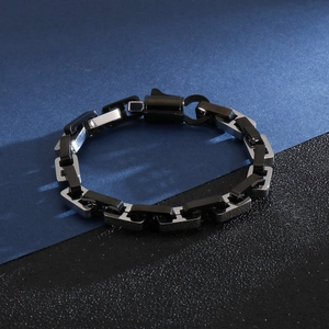 Detailed close-up of a two-tone black and silver stainless steel link chain for men