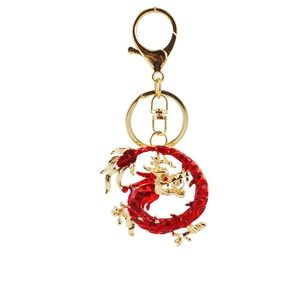 Golden keychain featuring a powerful red dragon design with elegant metal details