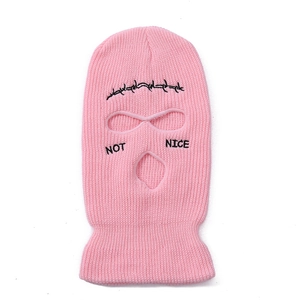 Pink knit balaclava with black barbed wire embroidery and Not Nice text detail
