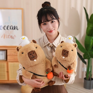 Brown capybara plush toy with a small white bird and orange crossbody bag on cozy home background