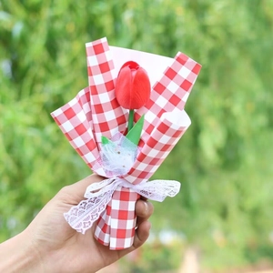 Handheld single red tulip bouquet with red-white plaid wrapping and a white lace bow