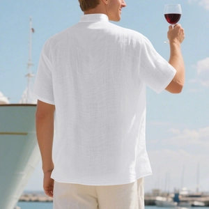 Rear view of white linen short sleeve shirt with stand collar in coastal vacation scene