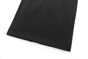 Macro view of detailed hem stitching on black strapless dress fabric texture