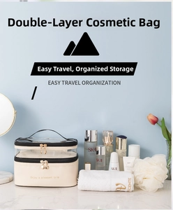 Detail view of double-layer makeup bag in beige PU and transparent TPU with gold zippers