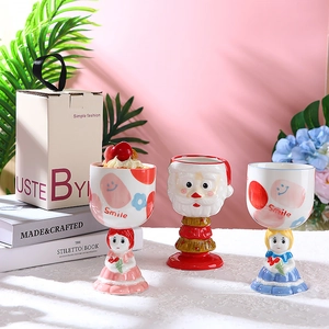 Cute Christmas themed ceramic goblet cups with Santa and girl illustrations for gifts