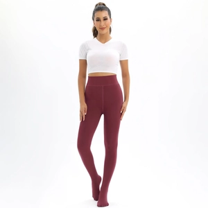 Detail of burgundy high-waisted footed leggings with a matte finish and thick fleece lining