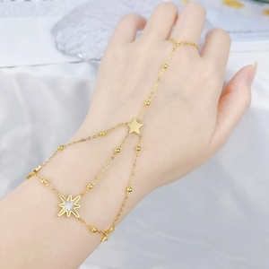 Elegant gold hand back chain bracelet with star charms and small round beads for women