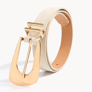 Detailed view of women's woven belt with a large polished gold metal buckle on white