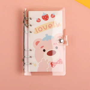 Detail of pink cartoon bear and strawberry printed on transparent PVC A6 binder notebook