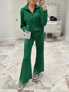 Detail of green long sleeve half-zip sweatshirt and wide-leg trousers lounge set