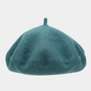 Detailed view of the wool felt texture and teal blue dome of this vintage beret hat