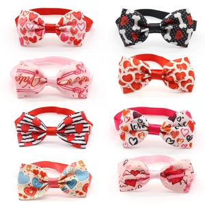 Valentine's Day dog bow ties set with heart prints in red and pink polyester