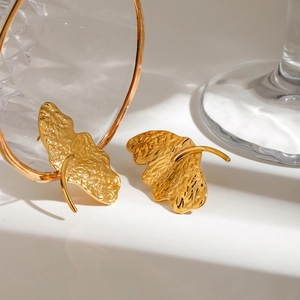 Textured gold leaf earrings with hammered finish in stainless steel for beach vacation