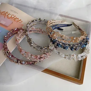Handmade crystal pearl twisted headband featuring heavy beaded design and baroque style