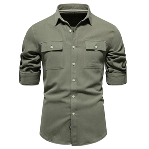 Detail of army green cotton work shirt featuring dual chest pockets and twill texture