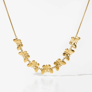 Golden stainless steel adjustable necklace featuring seven elegant butterfly pendants