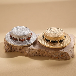Straw hat brooch in gold and silver finish with leather chain on natural stone