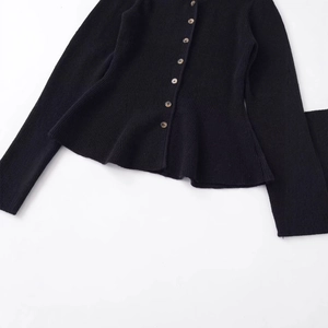 Women's black rib-knit cardigan with a peplum hem and stylish amber buttons
