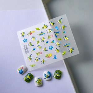 Detail showing 5D embossed nail stickers with realistic birds and floral patterns