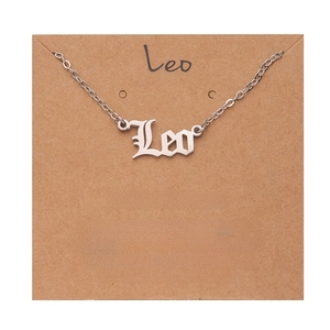 Silver Leo zodiac necklace in gothic font displayed on a descriptive kraft paper card