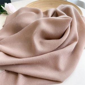 Close-up of khaki linen cotton scarf showing soft texture and fine woven details