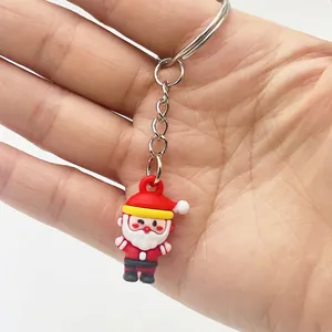 Detailed view of a 3D mini Santa Claus keychain made of soft PVC with a silver keyring