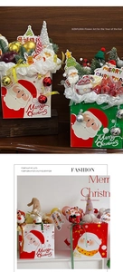 Christmas bouquet gift bag featuring Santa Claus graphics and holiday decorations