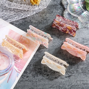 Set of five colorful cat-shaped acrylic hair claws with golden ear accents and feline motifs