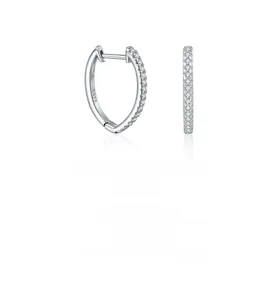Macro detail of S925 sterling silver hoop earrings with pave set moissanite stones