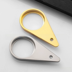 Detailed view of teardrop shaped metal bottle openers in gold and silver matte finishes