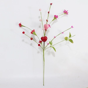 Detail of decorative faux stems featuring red hearts, pink flowers and green leaves