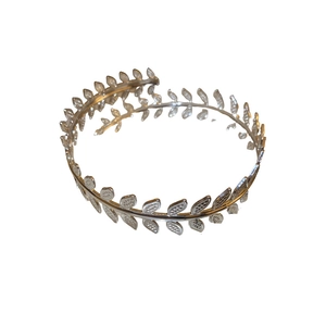 Elegant silver leaf branch cuff bracelet with textured foliage on white background