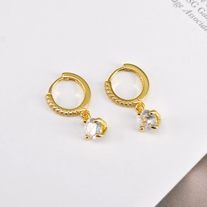 Macro shot of gold-plated S925 silver hoop earrings with clear cubic zirconia stones