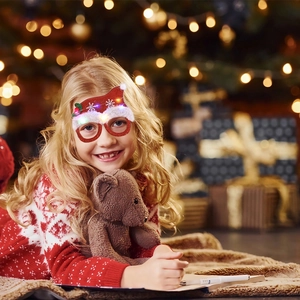 Detail of LED Christmas glasses worn by child featuring a festive Santa Claus design