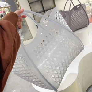 Detail of light gray hollow diamond pattern on a translucent silicone beach tote bag