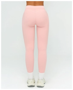 Detailed back view of pink high-waisted yoga pants showing seamless push-up lifting effect