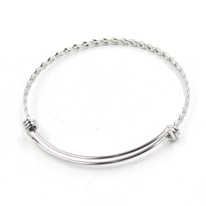 Macro detail of adjustable stainless steel twisted wire bracelet with sliding mechanism
